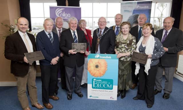Celebrating winning the Community Rail Halt Award for Whitehead train station areL (from left)Stephen Daye, Carrickfergus Borough Council, David Brown, Bill Luney, Bill Pollock, aall Brighter Whitehead, Angela Coffey, Translink board member, the Mayor of Carrickfergus, Ald Billy Ashe, Ald Arnold Hatch, president of the Northern Ireland Local Government Association, Moira Rodgers, Brighter Whitehead, Frank Moore, Translink NI Railways Route manager, Ald May Beattie and Philip Bryan, Brighter Whitehead. INCT 14-793-CON