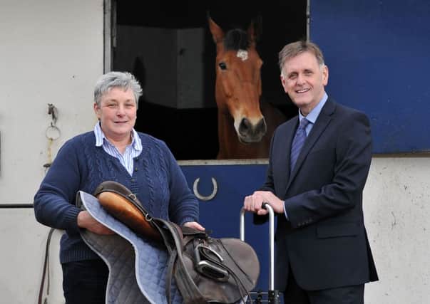 PRESS RELEASE IMAGE

27/3/14: Dromara-based Rolltack Ltd. has been assisted by Invest Northern Ireland to develop an innovative product that makes transporting heavy and awkward equestrian equipment easier and safer. Pictured (left) is Clare Medland, Rolltack, with Mark Bleakney, Invest NI. Picture: Michael Cooper