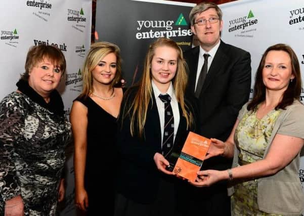 Mary, centre, with officials from the Young Enterprise gala event.