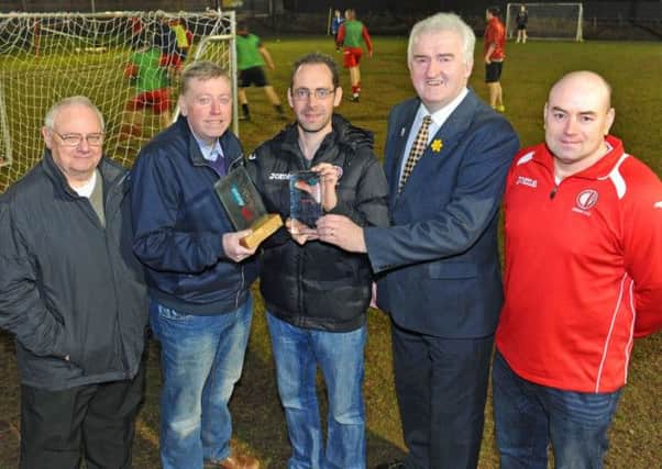 Pictured at the new Crewe United flloodlit pitch with the two Biffa Awards won by the local club are: (l-r) Davy Stewart, Crewe United; Alderman Paul Porter, Chairman of the Council's Leisure Services Committee; Thomas McKenna, Crewe United Manager; Councillor Alan Carlisle, Vice-Chair of Leisure Services Committee and Robert Walsh, Crewe United