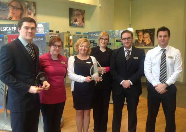 The Larne Specsavers team with the Best Small Store for Customer Service award. INLT 14-611-CON