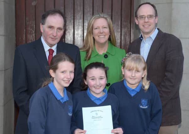 Pictured at the Mullaghdubh Primary School 100th anniversary service in 1st Islandmagee Presbyterian Church are (back): Chairman of the Board of Governors, Crawford Wilson; Principal Mrs Arlene Cambridge, and Rev Peter Bovill with pupils Leah Cambridge, Katie McErlain and Fay Bolt. INLT 14-301-PR