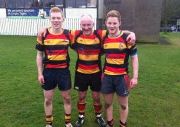 Neil McIwaine with his sons Ben and Mark.