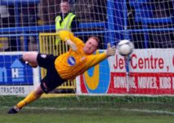Institute goalkeeper Michael Doherty.