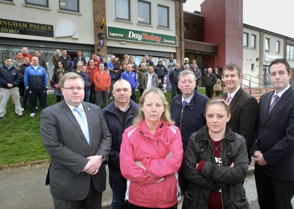 Residents and politicians have come out in a show of support for shop-owners at Lagan View Enterprise Centre who have suffered a series of break-ins over recent weeks. Pictured (front) are Diane McLucas, owner of Barkingham Palace, and Melanie Hepburn, owner of Day Today, along with Jonathan Craig MLA, Adrian Bird, chair of Lagan View Enterprise Centre, Alderman Paul Porter, Edwin Poots MLA and Paul Givan MLA. US1414-576cd Picture: Cliff Donaldson