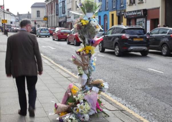 Flowers are left close to the scene of last week's accident on Railway Street. Six-year-old Diarmuid Frazer later passed away in the Royal Victoria Hospital in Belfast. US1414-568cd Picture: Cliff Donaldson