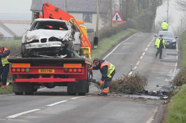 The white Seat car in which a 23-year-old woman was killed in a two car collison on the Agivey Road near Kilrea on Thursday morning in taken away. The male victim who was in a Peugeot car was taken to hospital. PICTURE NARK JAMIESON.