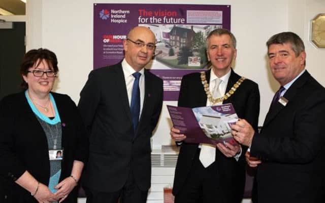 Lord Mayor of Belfast, Councillor Máirtín Ó Muilleoir, (second from right) is welcomed to the NI Hospice's temporary premises at Whiteabbey Hospital by Loretta Gribben (Director of Nursing and Patient Services), Dr Max Watson (Director of Medical Services) and Chairman of NI Hospice, Councillor Billy Webb (right).