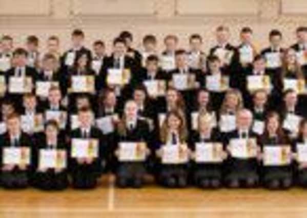 Carrickfergus College year 8 pupils with their certificates after their Heartstart training.  INCT 15-725-CON