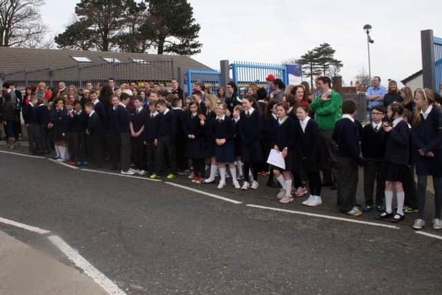 Pupils from St. Patrick's and St. Brigid's as well as Ballycastle High School turn out to support the Cross and Passion hurlers.INBM17-14 111F