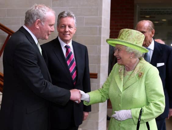 Queen Elizabeth II shakes hands with  Martin McGuinness. Paul Faith/PA Wire