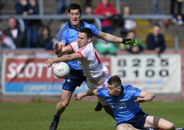 Tyrone's Kyle Coney and Dublin's Rory O'Carroll with Jason Whelan in action at Sundays Game.
©Russell Pritchard / Presseye