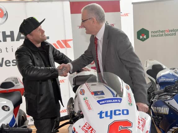 PACEMAKER, BELFAST, 31/3/2014:  Prodigy star Keith Flint meets DRD Minister Danny Kennedy at the launch of the Vauxhall International North West 200 in the Titanic Building, Belfast today.
Flint is the boss of Team Traction Control, which will race at the North West in May.
PICTURE BY STEPHEN DAVISON