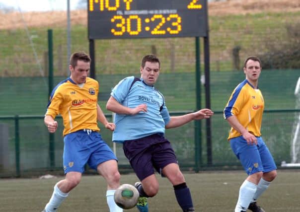 BATTLE... Killymoon Rangers and Moyola Park battle for the ball during Saturday's league encounter at MUSA.INMM1514-339