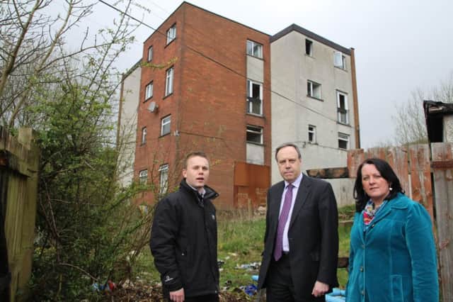 Nigel Dodds MP, Paula Bradley MLA and Councillor Thomas Hogg outside the derelict block of flats at Old Irish Highway, Rathcoole. INNT 15-517CON