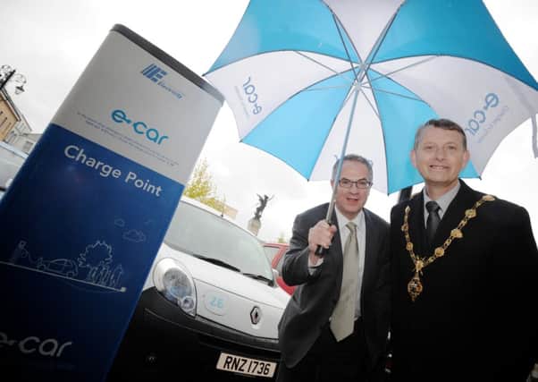 Former Mayor Maurice Devenney, pictured with erstwhile Environment Minister Alex Atwood at the launch of the former electric car charging point in the Diamond.