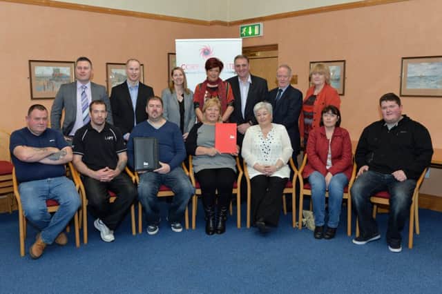 Participants (all seated) who obtained an Institute of Leadership and Management Certificate in Social Economy are pictured with Carrickfergus Town Clerk Sheila McClelland, Sonia McCrory, from Carrickfergus Council, and the programme delivery team from Core-Vision Ltd, Gerry Faloona, Stanley Wallace, Margaret Patterson-McMahon and Seamus Conlon. INCT 15-008-PSB