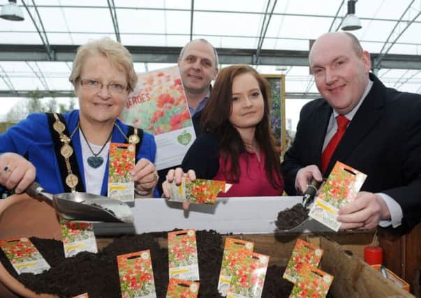 The Mayor, Councillor Margaret Tolerton; Mr Frank Mooty, General Manager of Dobbies; Aimee White, Community Champion at Dobbies Garen Centre, Lisburn and Alderman William Leathem encourage Lisburn Community to support Dobbies Poppy Planting Initiative in April.