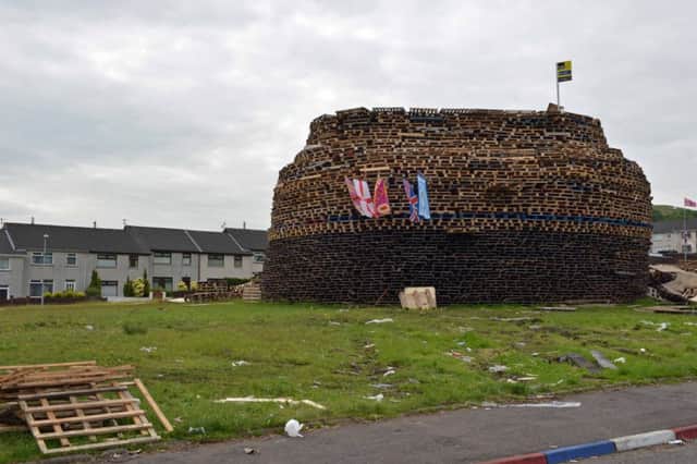 Last year's July 11 bonfire in the Ballyduff estate was built just yards from people's homes. It was later moved to land on the opposite side of Forthill Drive after residents voiced concerns about potential damage to their properties.