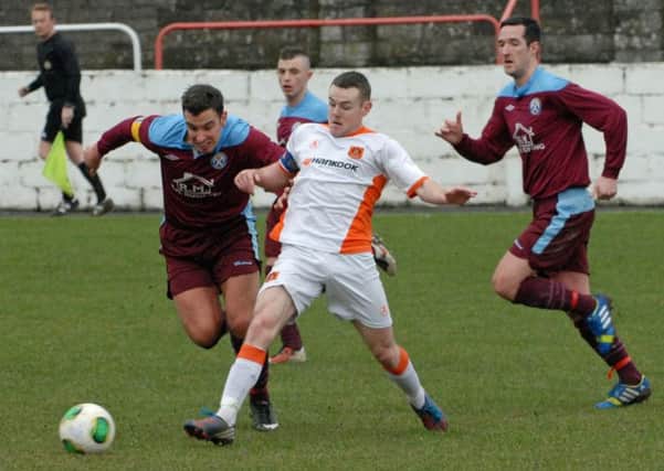Aaron Harmon in action for Carrick Rangers against Limavady United earlier in the season.