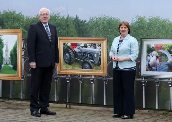 Pictured at the 'Art on the Rails' hoarding around the former Borough Offices at the Square, Hillsborough are (l-r) Alderman Allan Ewart, Chairman of the Economic Development Committee and Councillor Jenny Palmer, Chair of the Environmental Services Committee.