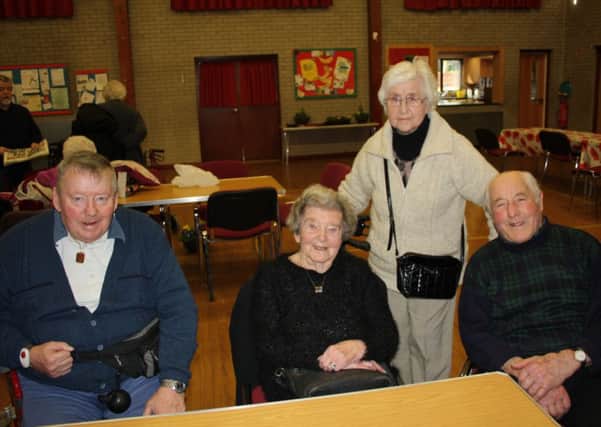 (From left) Harry Cain, Alice Flavelle, Kathleen McCormack and Stanley Orr who attend the Age NI day centre at St Pauls, Lisburn