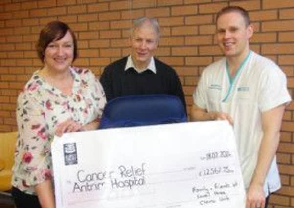 Seamus Laverty (centre) from Ballymena hands over a cheque for £12,567.75 on behalf of family and friends to June MacAuley of Laurel House and Kevin Campbell, Physiotherapy Unit Antrim Hospital. The money was raised at various events during 2013 for Cancer Relief Antrim Hospital and was used to purchase Syringe Pumps and Special Physiotherapy Chairs.