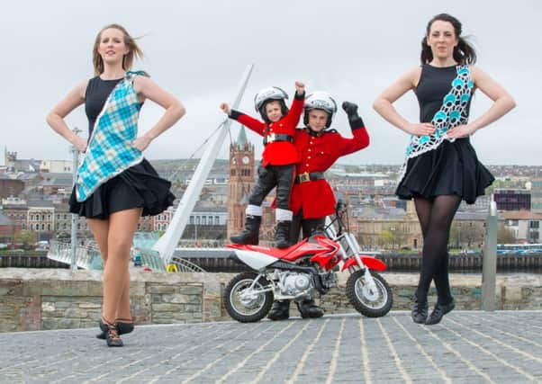 Highland and Irish Dancers, Georgina Kee McCarter and Bridgett Madden are joined by two of the world renowned motorcycle display team The Imps, Ben Steadman (6) and Jordan Baker (16) at the launch of the 2014 Walled City Tattoo. The show which was one of the highlights during Derry~Londonderry's year as City of Culture returns to Ebrington Square from the 27th to the 30th of August. Among the 550 strong cast will be the Parisian Fire Brigade Band, Switzerland's comedy acrobats, Starbugs and the Marsa Scouts Pipes and Drums from Malta as well as a wealth of local talent from bands to dancers. Picture Martin McKeown. Inpresspics.com.