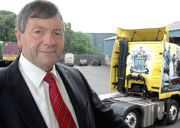 Ballymena United main sponsor Norman McBurney pictured with the club-liveried McBurney Transport lorry, created to mark the 25th anniversary of the firm's long-running sponsorship of the club in 2012.