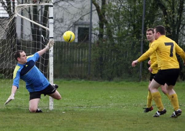 FC Antrim keeper Ryan McAllister makes a save from the Northend shot but fails to keep the rebound out. INBT16-263AC