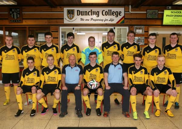 The Dunclug College football team pictured in their new kit sponsored by the Royal Air Force Careers. Included are Dougal Gow and Dave Tilsley from the RAF Careers. INBT16-213AC