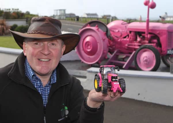Alastair Bell with the pink Giro d'Italia inspired tractor. INBM16-14