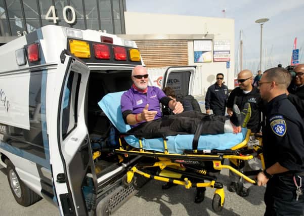 Andrew Taylor is taken to hospital on arrival in San Francisco.