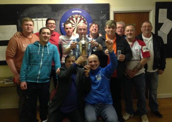 Social Staffers celebrate after winning the Ballymena, Harryville & District Darts League Division Two title.
