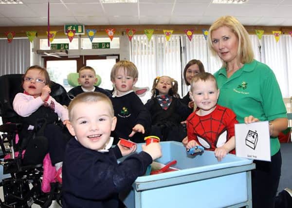 Nuala McNeiil with some of the pupils in the Buttercup Nursery at Rossmar School who have been benifiting from the Makaton complete language signs and skills program. INLV1514-114KDR