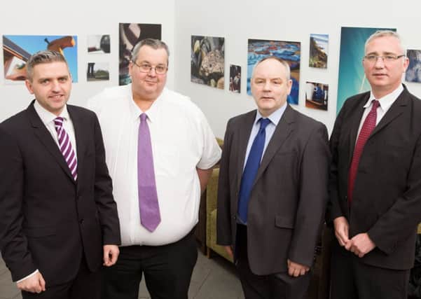 Dr Adrian Johnston, Chairman of the International Fund for Ireland is pictured with Kenny McFarland and Derek Moore both from the Londonderry Bands Forum and Brian Dougherty from St Columbs Park House.