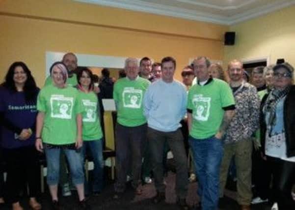 Samaritans volunteers who went fire walking to raise funds. INLT 16-625-CON
