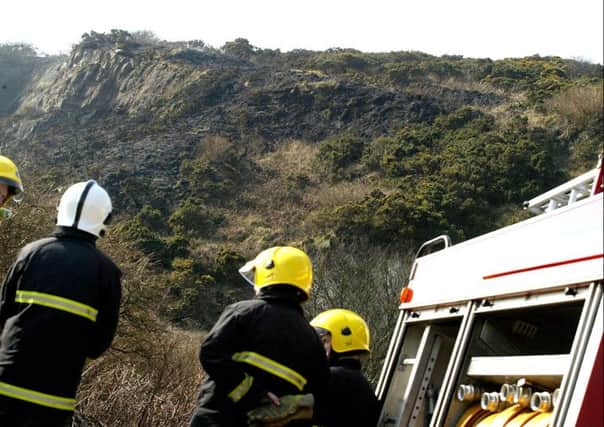 Firefighters at the scene of the gorse fire near houses at Whitehead in 2010.  picture: Pacemaker
