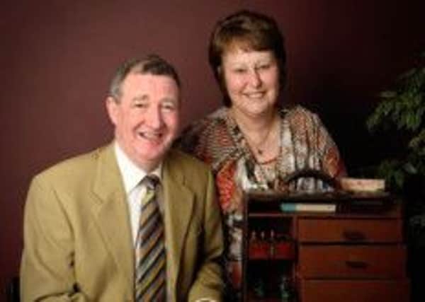 Dr Alan Hamilton who has retired from the Hill Street practice, pictured with his wife Edith.