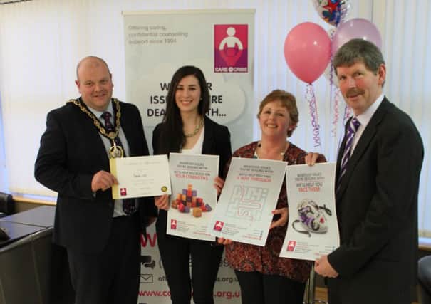 Mayor Mark Baxter with Klaudia Lisek (poster designer), Karen Moore, Director of Counselling (Care in Crisis) and John Beggs, Chair of Trustees (Care in Crisis) at the charity's 20th anniversary celebration.