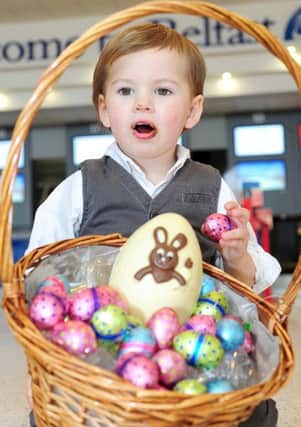 Little Shea Graffin is wishing the thousands of passengers travelling through Belfast International Airport this weekend a very Happy Easter. (photo by Pacemaker Press)