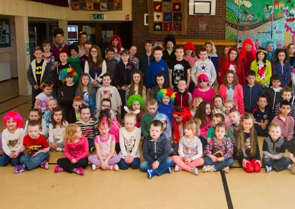 Pupils and staff from Kilrea Primary School who held a fundraising morning on Friday. Whacky Wigs and Hippy Hair, was to raise money for the Princess Foundation, a charity that makes wigs for children going through cancer treatment. The day raised £300. INCR16-158PL