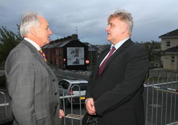UKIP FOUNTAIN VISIT. . . .Neil Hamilton, Vice Chair, United Kingdom Independence Party pictured in conversation with Henry Reilly, UKIP Euro election candidate, on a visit to the Fountain Estate in Londonderry last week. INLS1614MC019