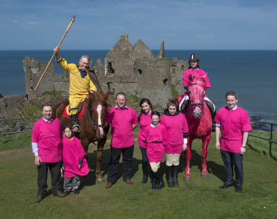 The Giro pink horse along with Sorley Boy McDonnell is ready to grant the cyclists safe passage through the Dunluce Castle area in May. INBM17-14