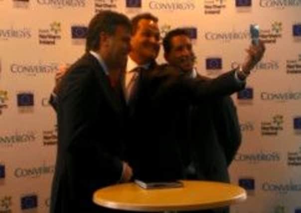 Invest NI chief Alastair Hamilton, Convergys Chief Commercial Officer Mike Wooden and Scott McGimpsey from Everything Everywhere (EE) in good form posng for a 'selfie' as over 300 jobs were promised in Londonderry on Thrusday (April 17).