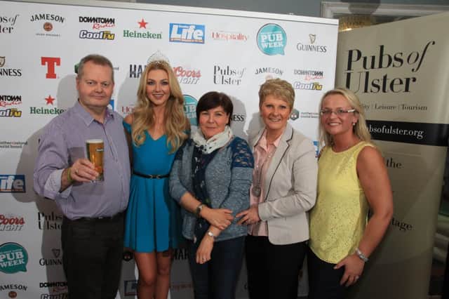 Miss Northern Ireland, Meagan Green and Olga Walls (right), Derg Arms, join Stephen Reynolds and staff from the Front Page Bar at the launch of The Great Ulster Pub Week at Café Vaudeville. The Great Ulster Pub Week, which takes place 1st-9th May 2014, will be the biggest pub centric multi-venue event seen in Northern Ireland and with over 140 pubs across Northern Ireland already signed up, it promises to showcase great food, great entertainment and great craic. For further information, visit www.greatulsterpubweek.com or find The Great Ulster Pub Week on Facebook, Twitter, You Tube and Instagram using the hashtag, #UlsterPubWeek . Photos by Darren Kidd at Press Eye.
