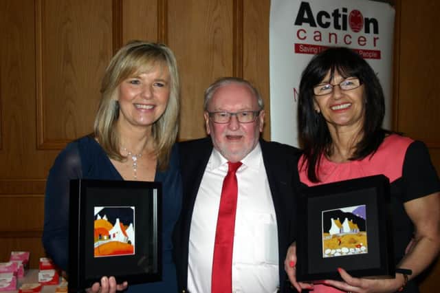 Deborah Yea (left) Irene McCune displaying twoThomas Joseph paintings bought by Des Wilson (centre) during a charity auction on the evening. INCT 17-754-CON.