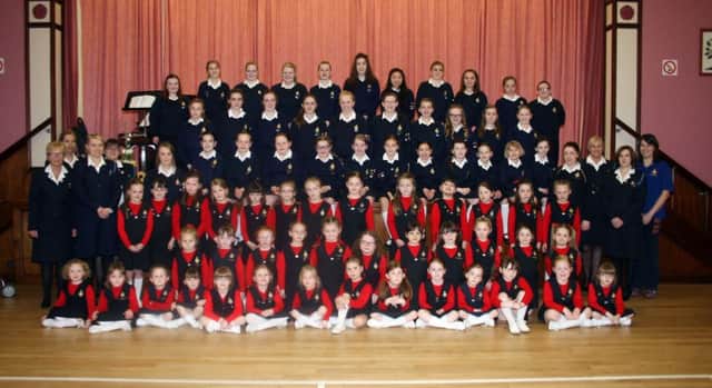St. James's Girls Brigade pictured at their 50th annual Parents' Night in the church hall. Included is Captain, Anne Walsh.INBM18-14 109LMM