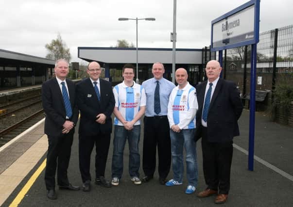 Ballymena United fans Phillip Simpson and Davy McCaig are pictured with Translink officials Rodney Ferris, David Simpson, Andrew McQuilken and Frank Moore (Manager), at Ballymena Train Station, where Translink are putting on a special train for fans traveling to the Irish Cup final. INBT17-200AC