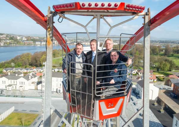 New view, for you, to do!,  Joe Cullen, Paul Doherty, Ilex, Douglas Taylor, M&MW Taylor and Stephen Twells, Foyle Search & Rescue, pictured at top of the Ebrington Eye with Cullens Fun Fair which will be based at Ebrington over the Easter Holidays, until Sunday 27th April, giving visitors a view of Derry~Londonderry from 150ft above the River Foyle. Foyle Search and Rescue are the charity chosen by Cullens who will collect donations at the entrance to the fair. Picture Martin McKeown. Inpresspics.com. 18.4.14